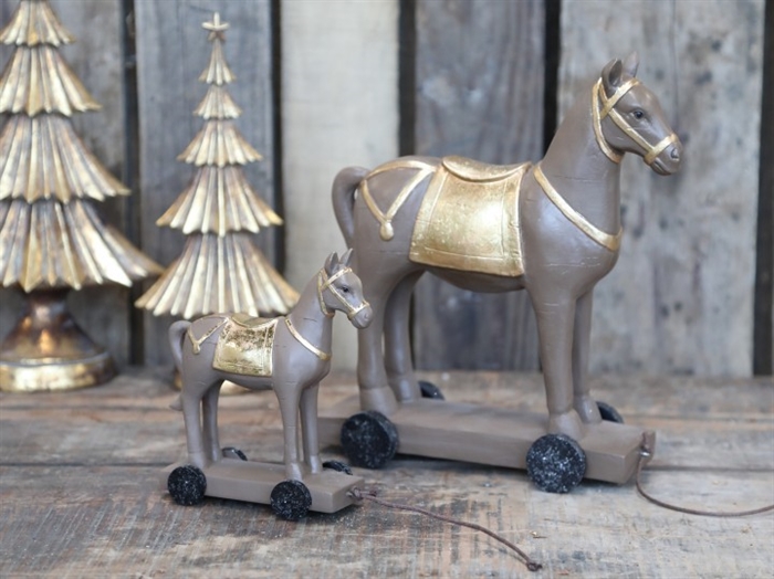 Hest på hjul lille i  antique guld